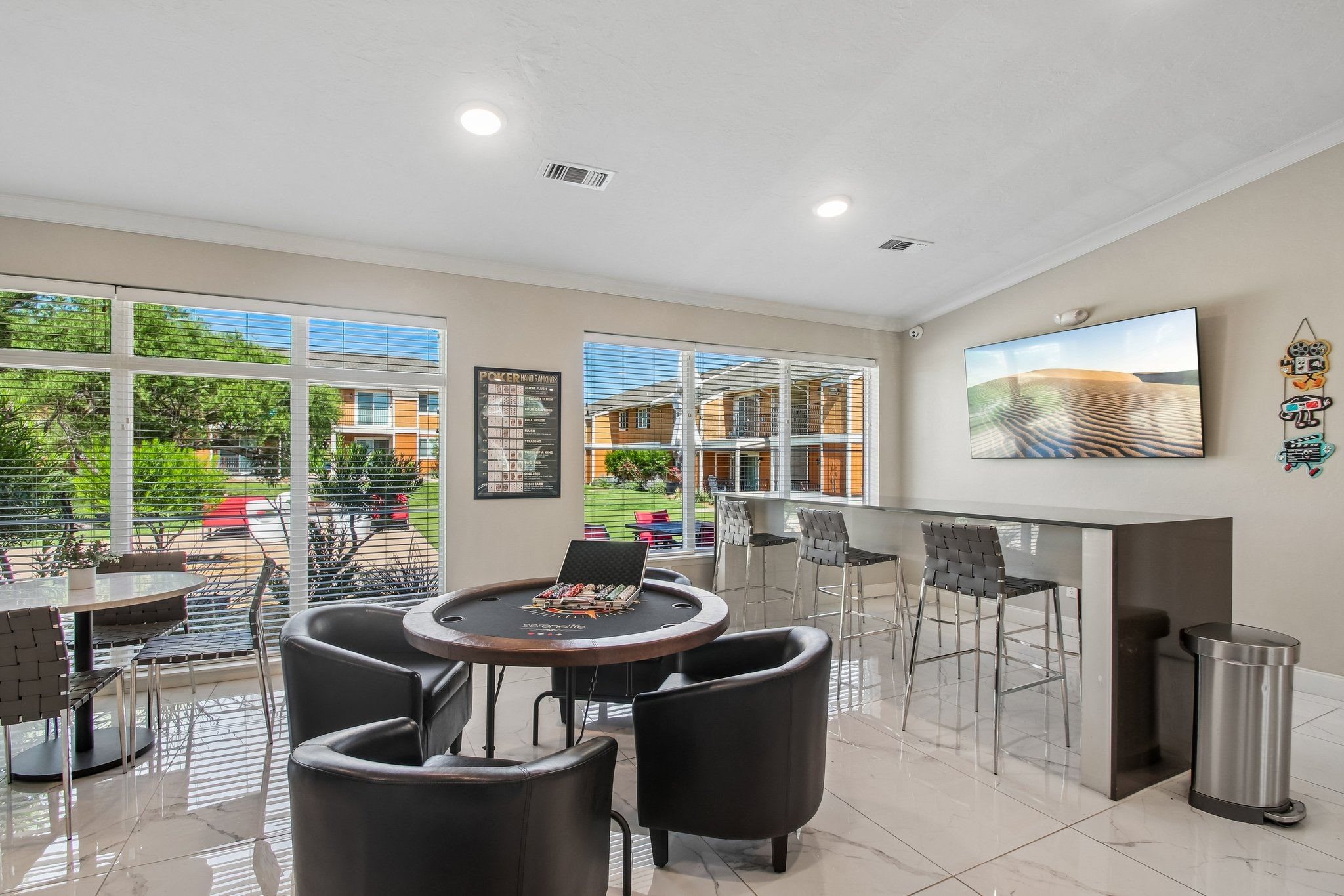 A modern dining area with a round table and chairs.